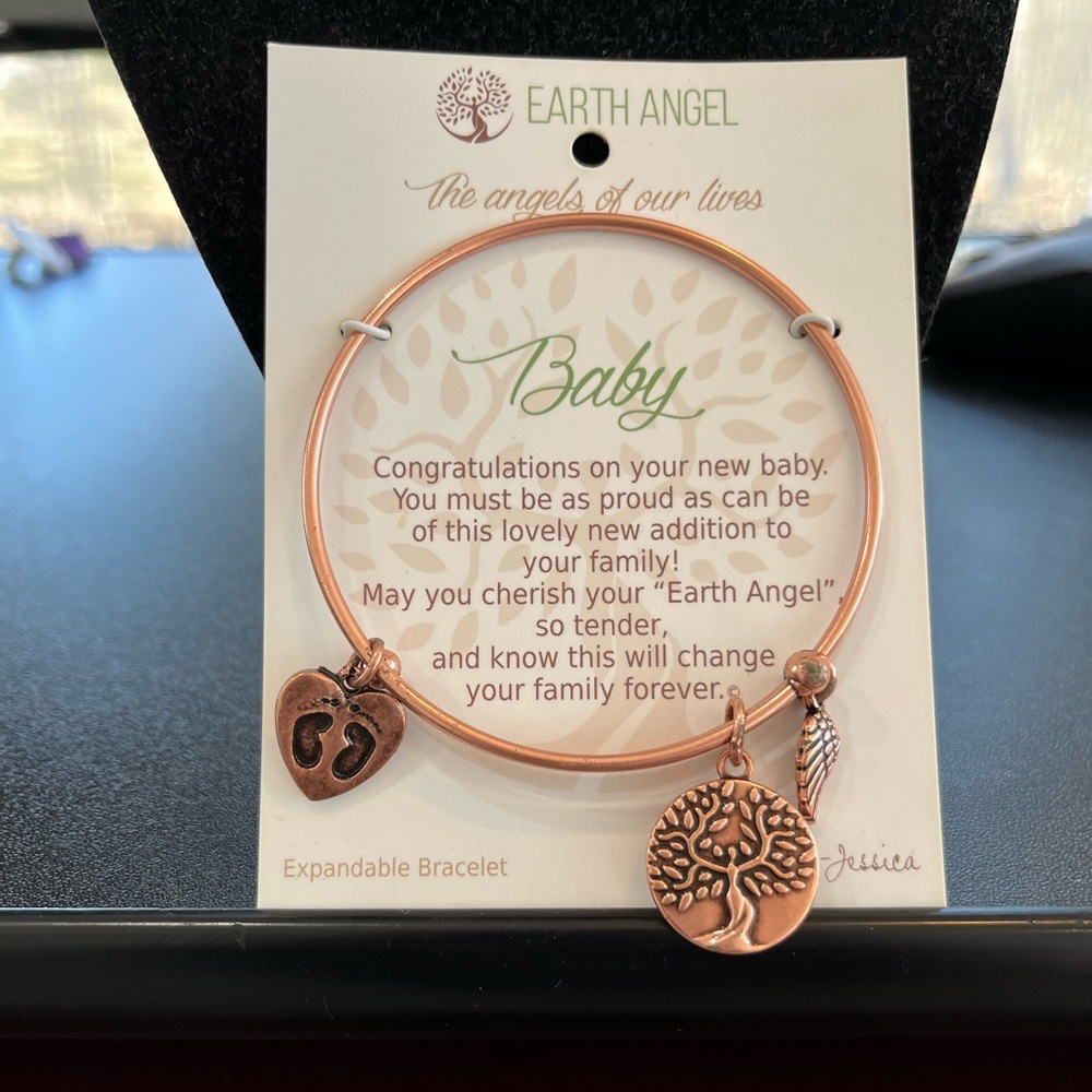 Rose gold colored adjustable charm bracelet. New